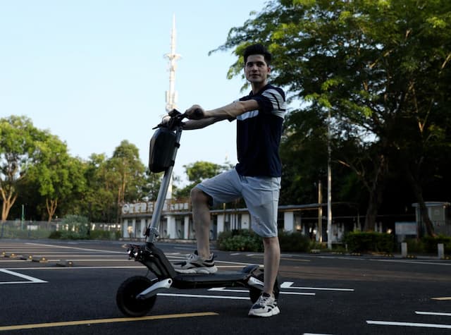 a young man on an electric scooter